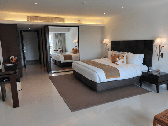 Room at The Mansion House featuring elegant interiors, cosy bedding, modern furnishings and thoughtfully curated amenities, offering a relaxing and memorable stay in a refined setting.