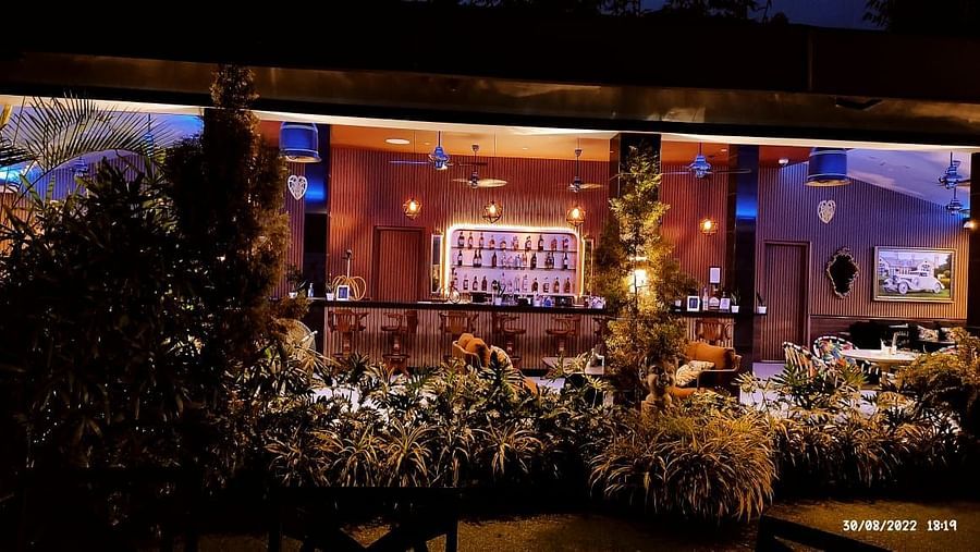 the bar showcasing a rack full of alcohol bottles - Mayfair On Sea, Morjim, Goa