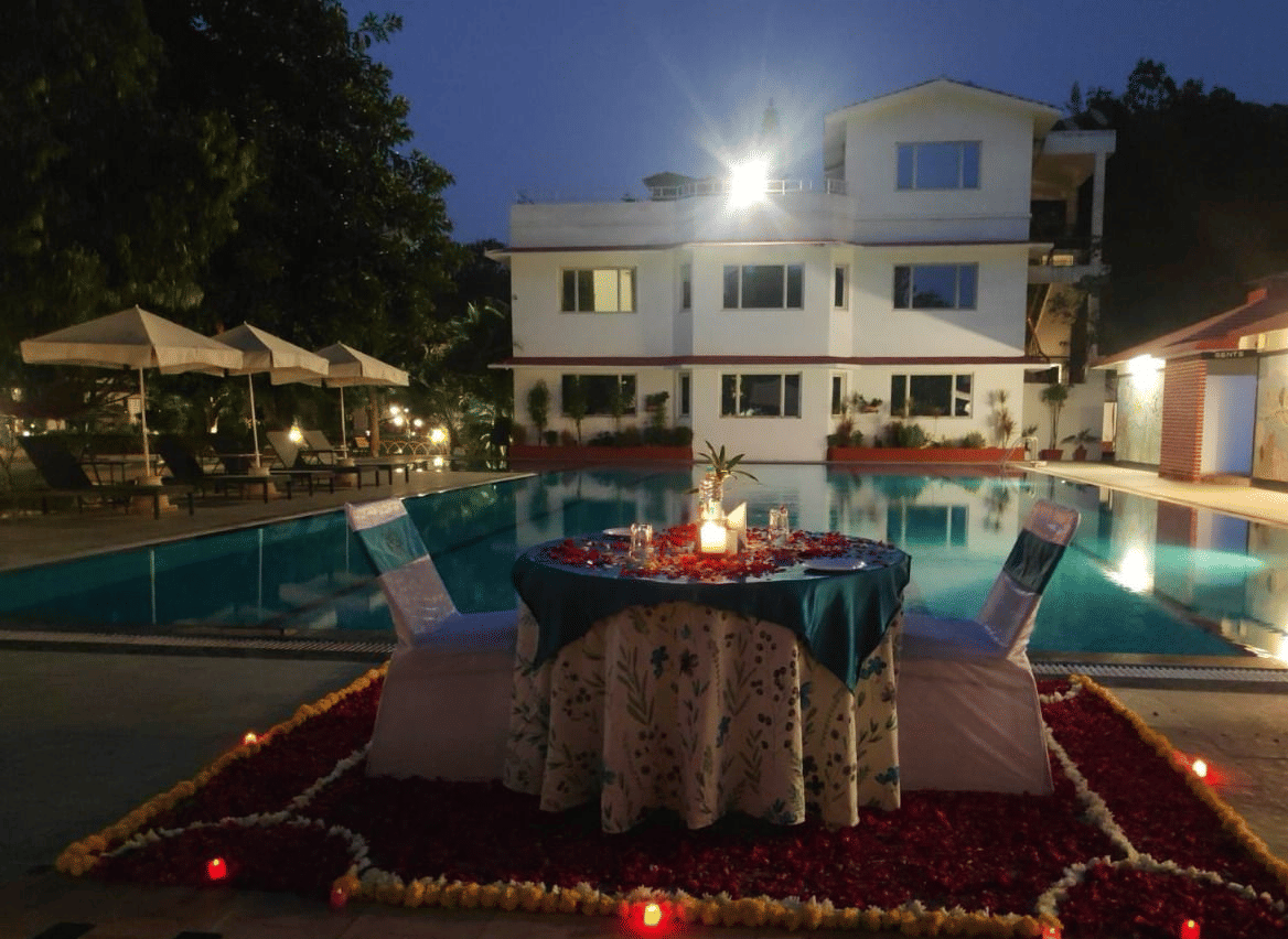 private couple dining at the poolside