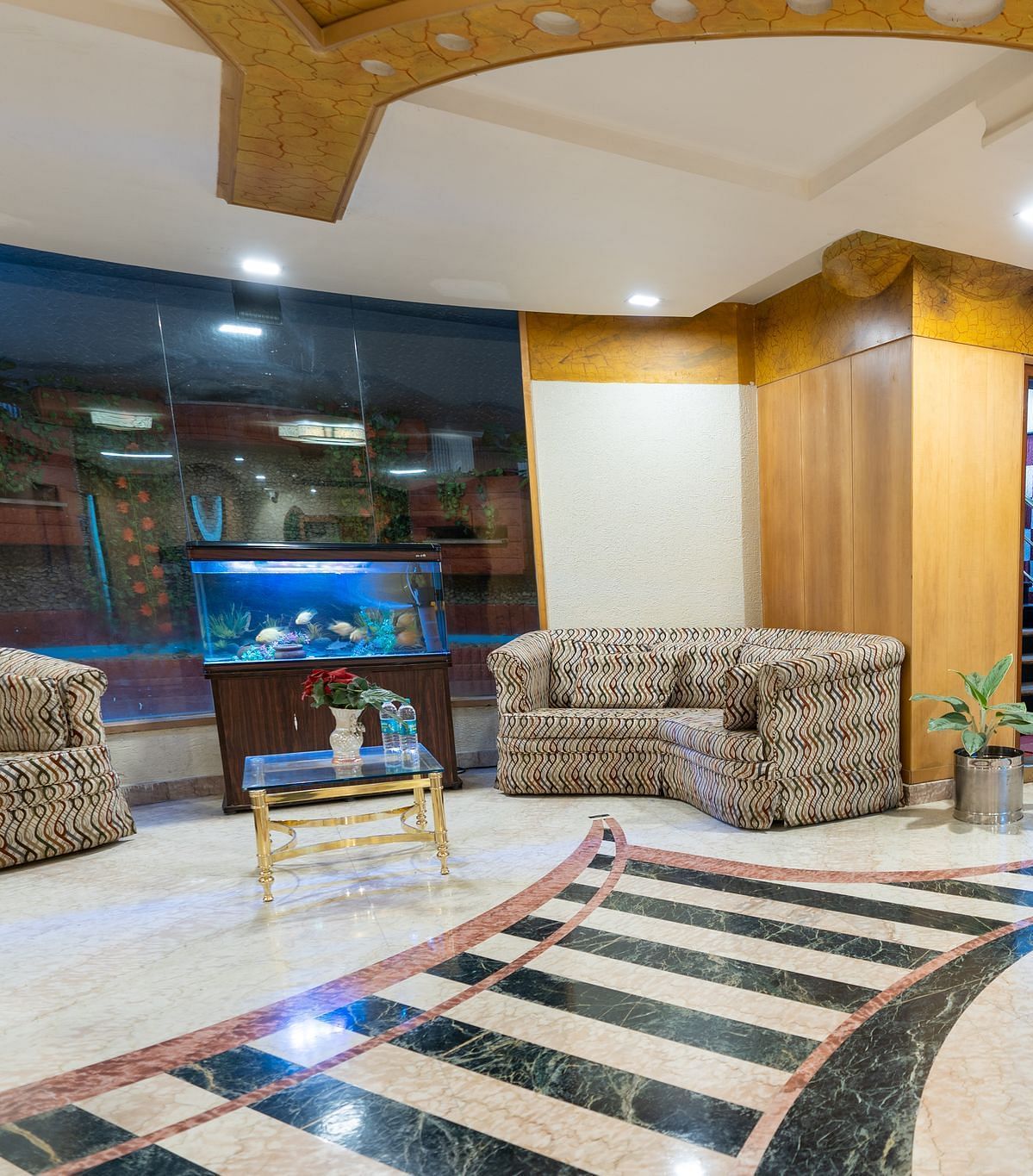 overview of the lobby with seating arrangements inside it - Hotel Pai Comforts, JP Nagar