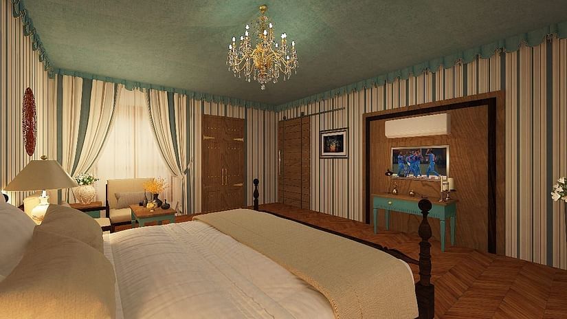 a king size bed facing the TV in one of the rooms in Ranthambore at The Baagh Ananta Elite