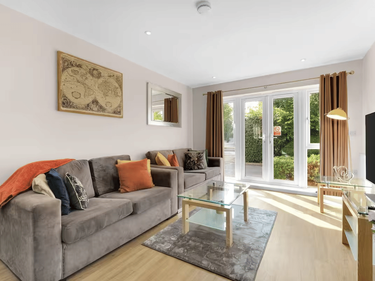The living area of a two-bedroom, two-bathroom Heathrow Living apartment by 360Stays