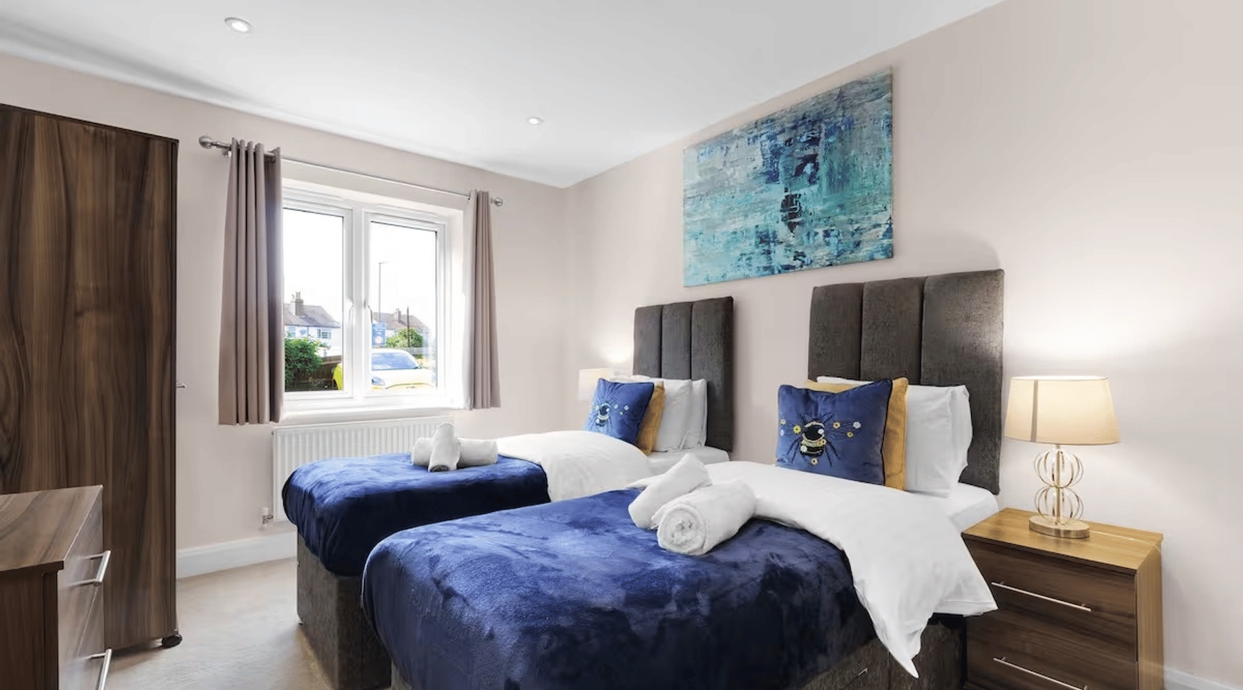 A twin bedroom in a two-bedroom Heathrow Living apartment by 360Stays