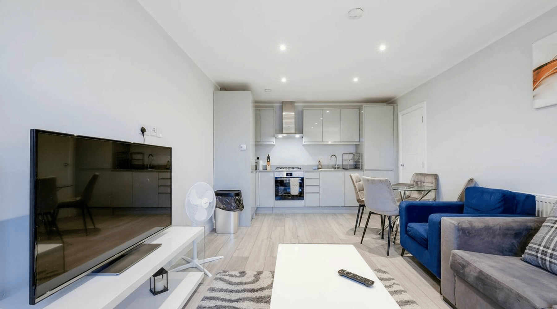 The open-plan living and kitchen area of The Modern Apartment, a two-bedroom 360Stays home with parking