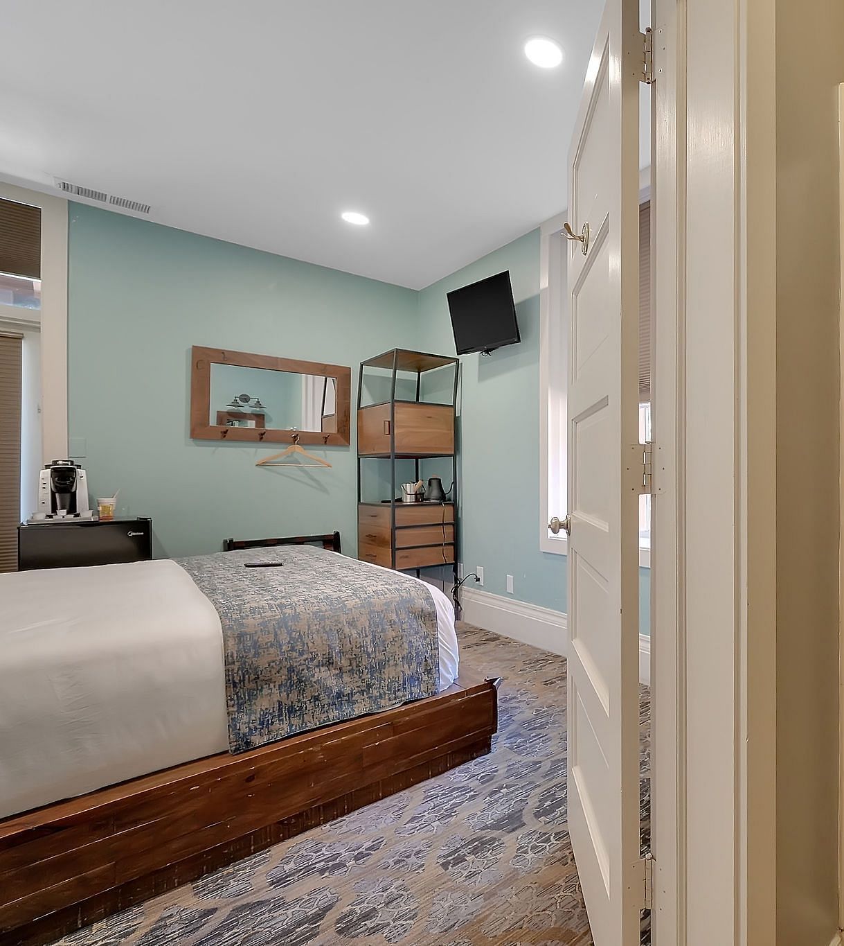 A view of a room at The Groveland Hotel with a double bed.