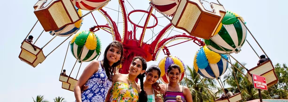 a group of women posing for a picture at MGM Dizzee World