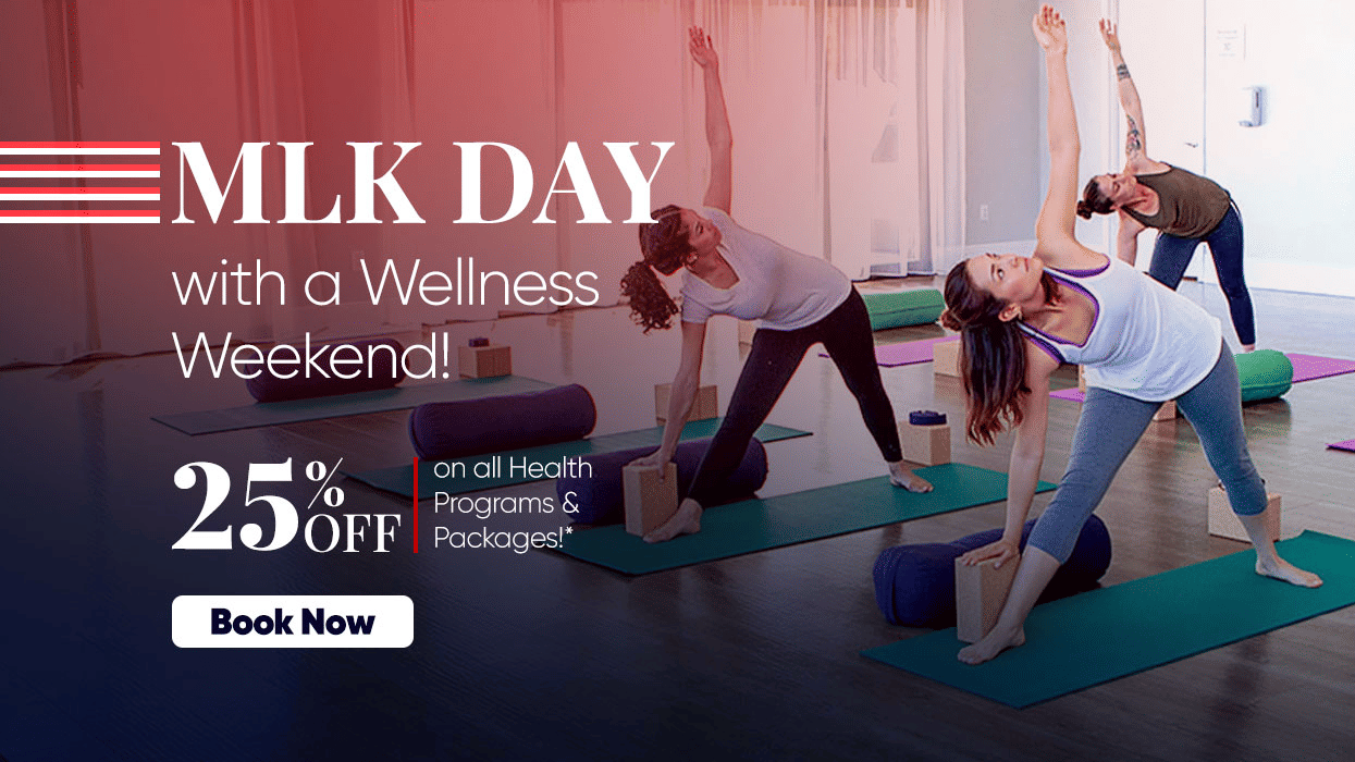 People participating in a group yoga session indoors, promoting a special MLK Day wellness offer with 25% off