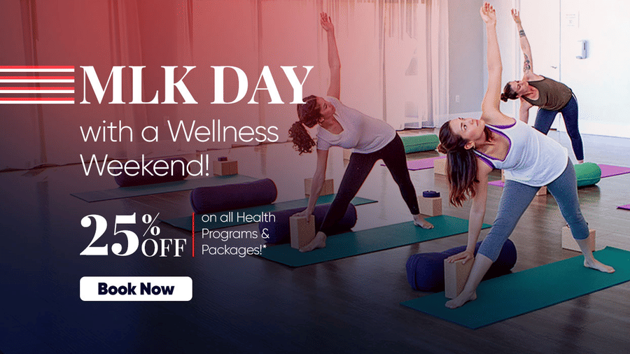 People participating in a group yoga session indoors, promoting a special MLK Day wellness offer with 25% off