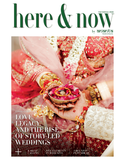 Ananta Hotels & Resorts Here and Now magazine Fall 2026 cover, Indian wedding ritual scene with bridal henna hands and rose petal ceremony bowl
