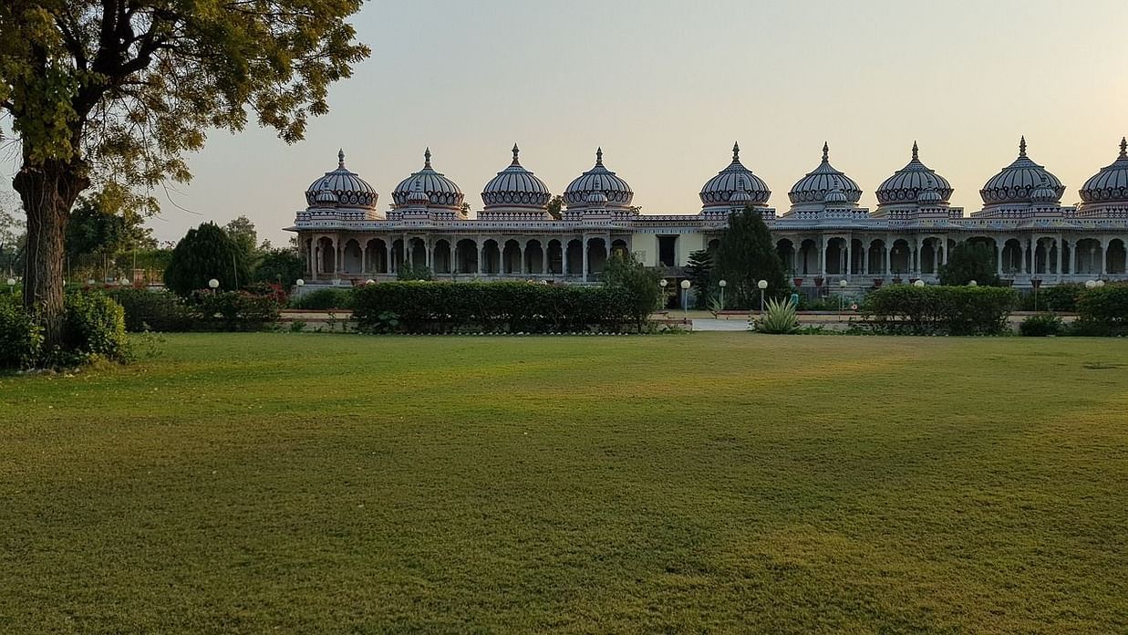 a temple in Bhilwara featuring a lawn during dayitime
