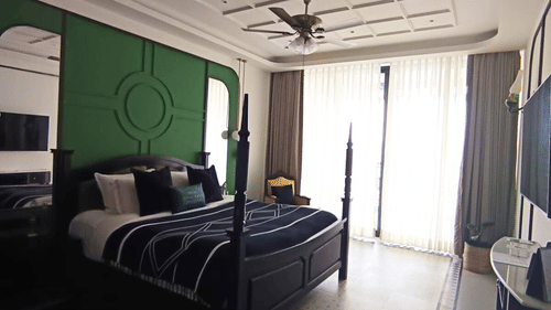 Modern bedroom with unique wall design and large windows - Polo Cherrapunjee Resort