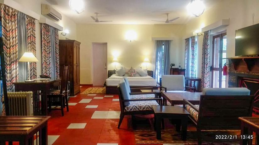 room with comfortable bed,study table and sofa set