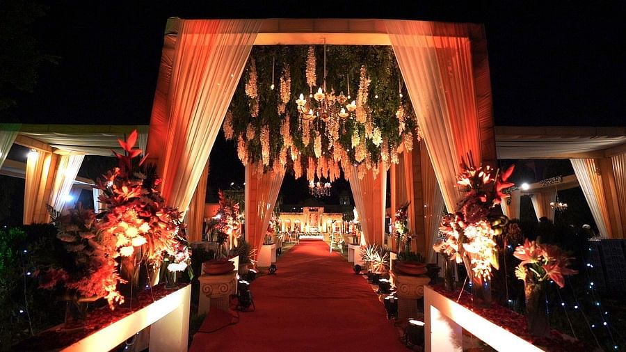 entrance to a wedding venue with decorated arches and bouquet of flowers - heritage village resorts & spa, Manesar