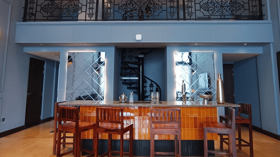 Dining area with a table and chairs, and a view of a loft above - Polo Cherrapunjee Resort
