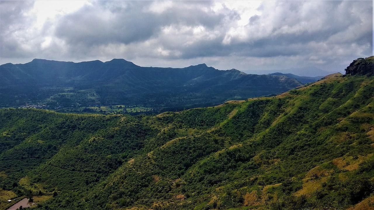 vast mountain ranges with the white clouds 