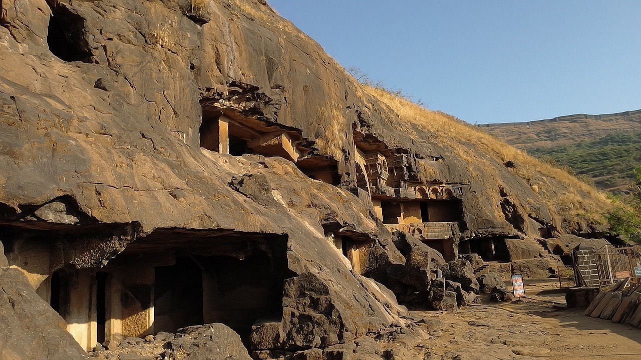 an image of an ancient building with blue sky in the background