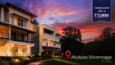 A promotional banner showcasing a modern multi-storey building at Lords Riverside Resort Muduba Shivamogga illuminated in the evening with landscaped pathways and a limited period price offer displayed prominently.