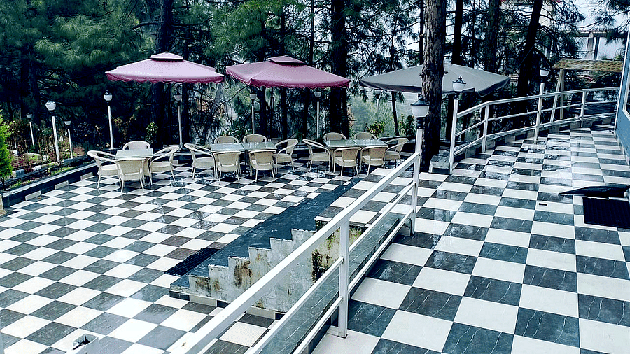 Open restaurant at DLS Nature Trinket Resort with chairs and tables.