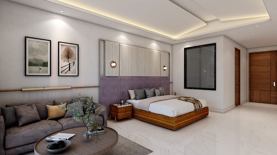 A spacious room featuring a double bed alongside a common seating area. - Namaste Corbett