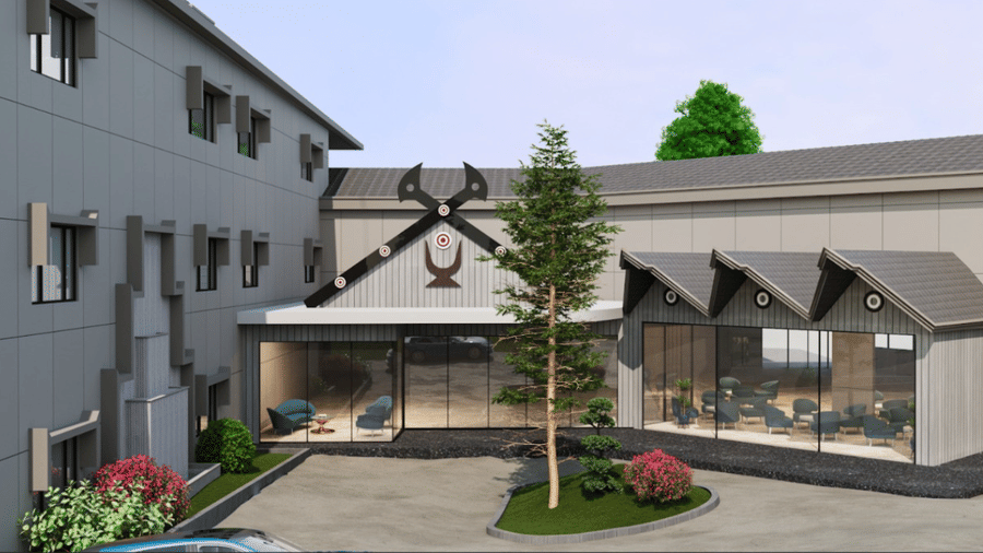 Exterior perspective of multi-storey hotel building with glass front entrance, trees, and paved courtyard.