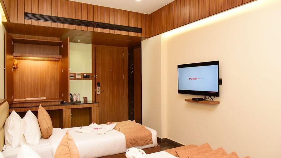 Twin beds with an LCD Television at TGI Felicity, Bangalore
