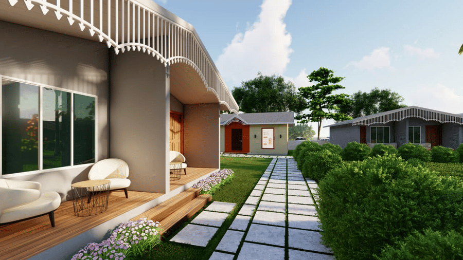 Grey coloured houses with curving roofs featuring a white outdoor sofa on a small porch at Trishvam Palolem Beach Resort, Goa.