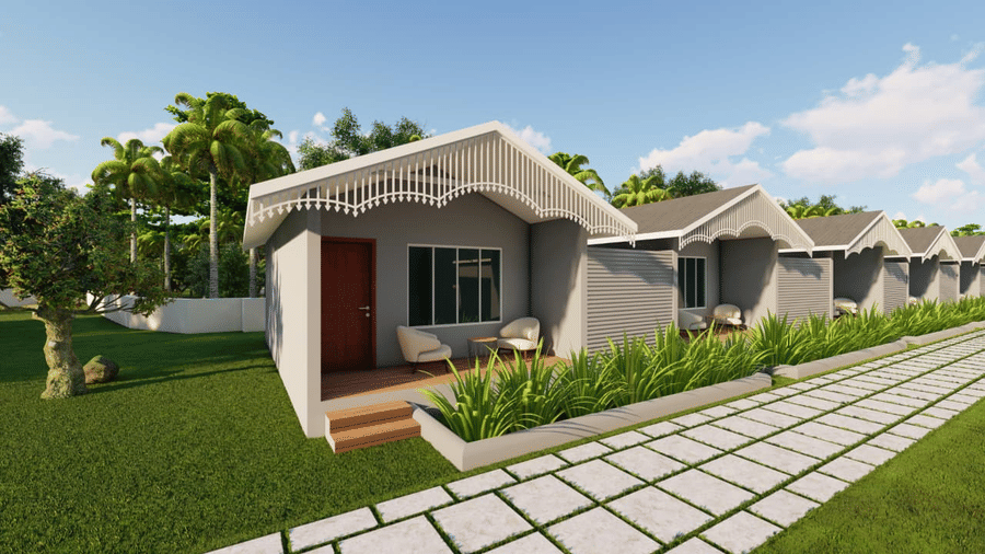 A view of three small grey houses with curving roofs and a grid-like white walkway at Trishvam Palolem Beach Resort, Goa.