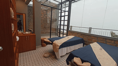 two spa beds kept ready with blue sheets covering the bed