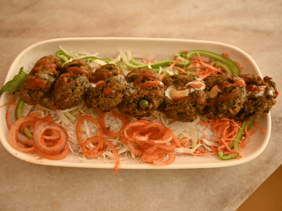 Chulha-cooked food plated for service at Signum Resort, Bandhavgarh