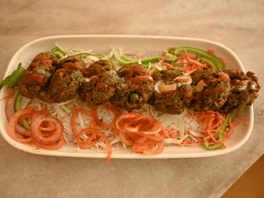 Chulha-cooked dishes plated for service at Signum Resort, Bandhavgarh