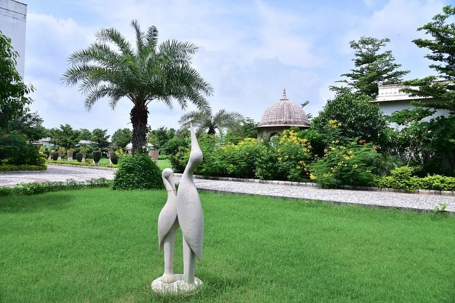 A lawn area featuring swan sculptures - Clarks Safari, Ranthambore