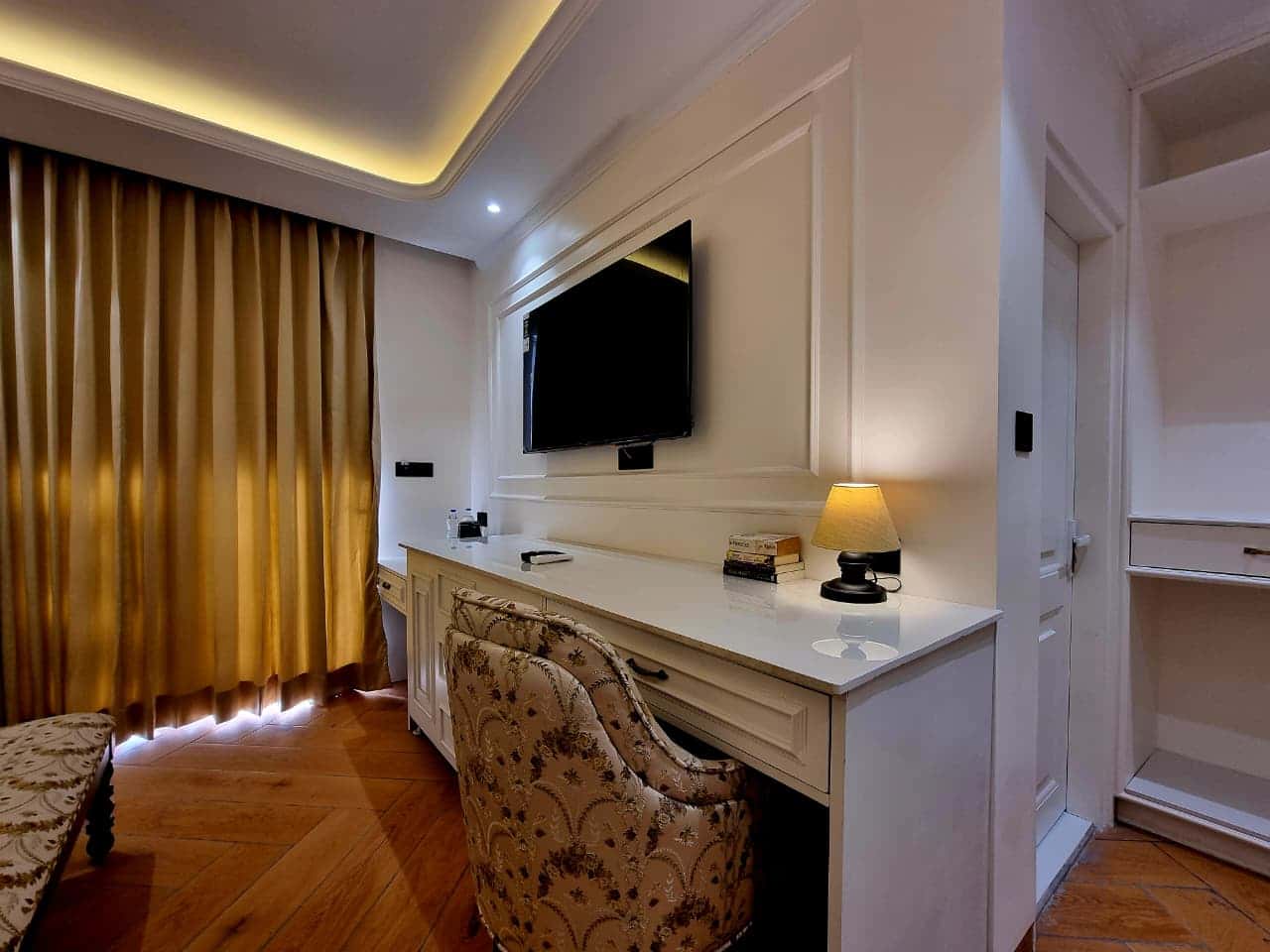 In-room 55-inch Smart TV with work desk and reading lamp