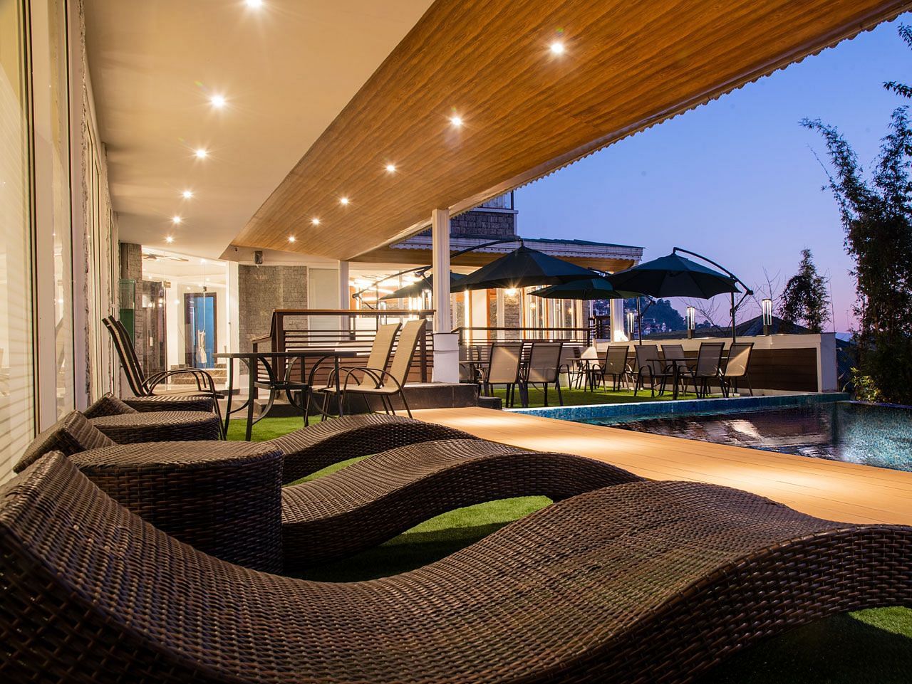 A close up shot of the sun loungers placed by the pool - Summit North Star, Gangtok