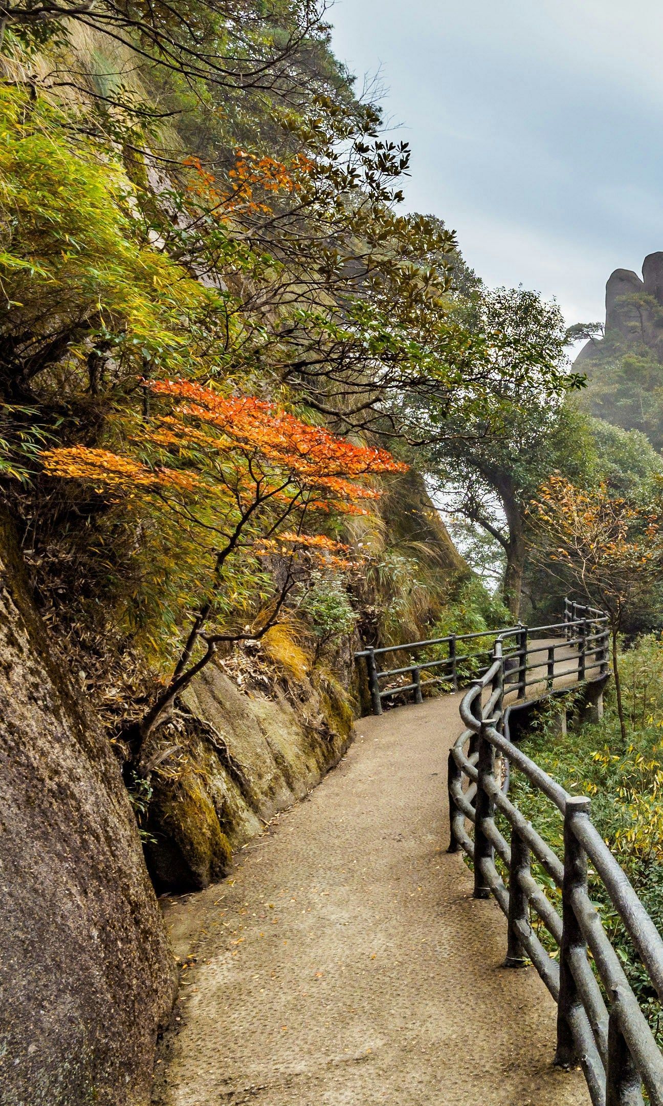 An image of a pathway by the side of mountains
