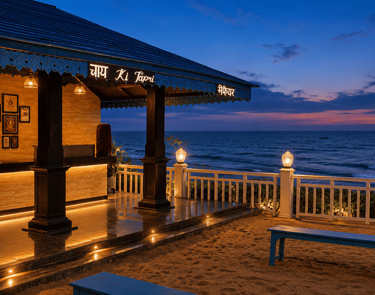 Beachfront Chai Ki Tapri tea kiosk with a blue pitched roof, illuminated signage and bench seating on the sand at MAYFAIR Palm Beach Resort, Gopalpur-on-Sea.