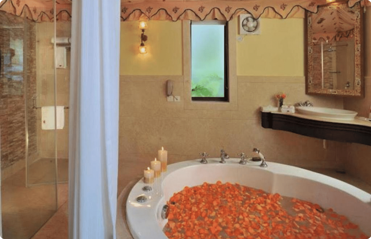 Image of a jacuzzi filled with flower petals at Rajasthali Resort & Spa Jaipur.
