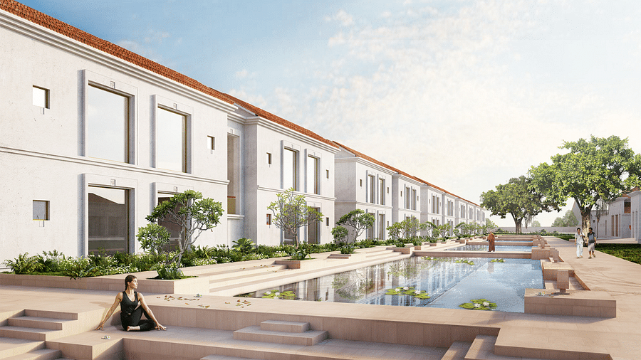 A modern resort with a central reflecting pool and people relaxing around it.