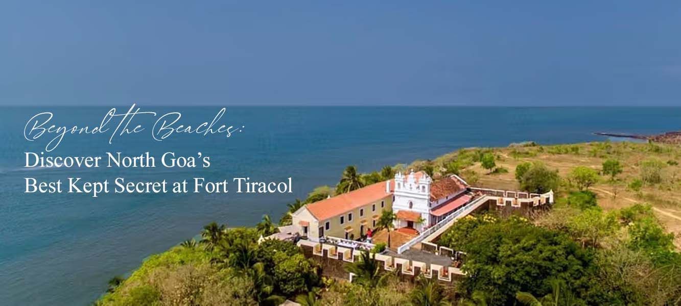 Aerial view of Fort Tiracol on a cliffside overlooking the Arabian Sea, text overlay: Beyond the Beaches: Discover North Goas Best Kept Secret at Fort Tiracol.