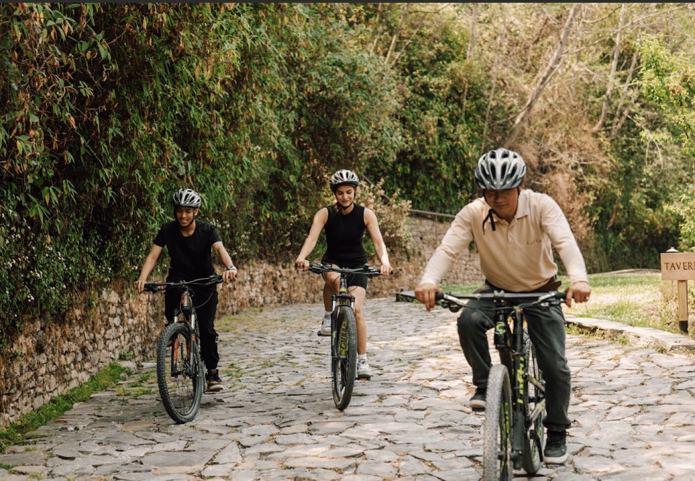 A picture of three young boys cycling on a pavement | Kavya Resort and Spa, Nagarkot