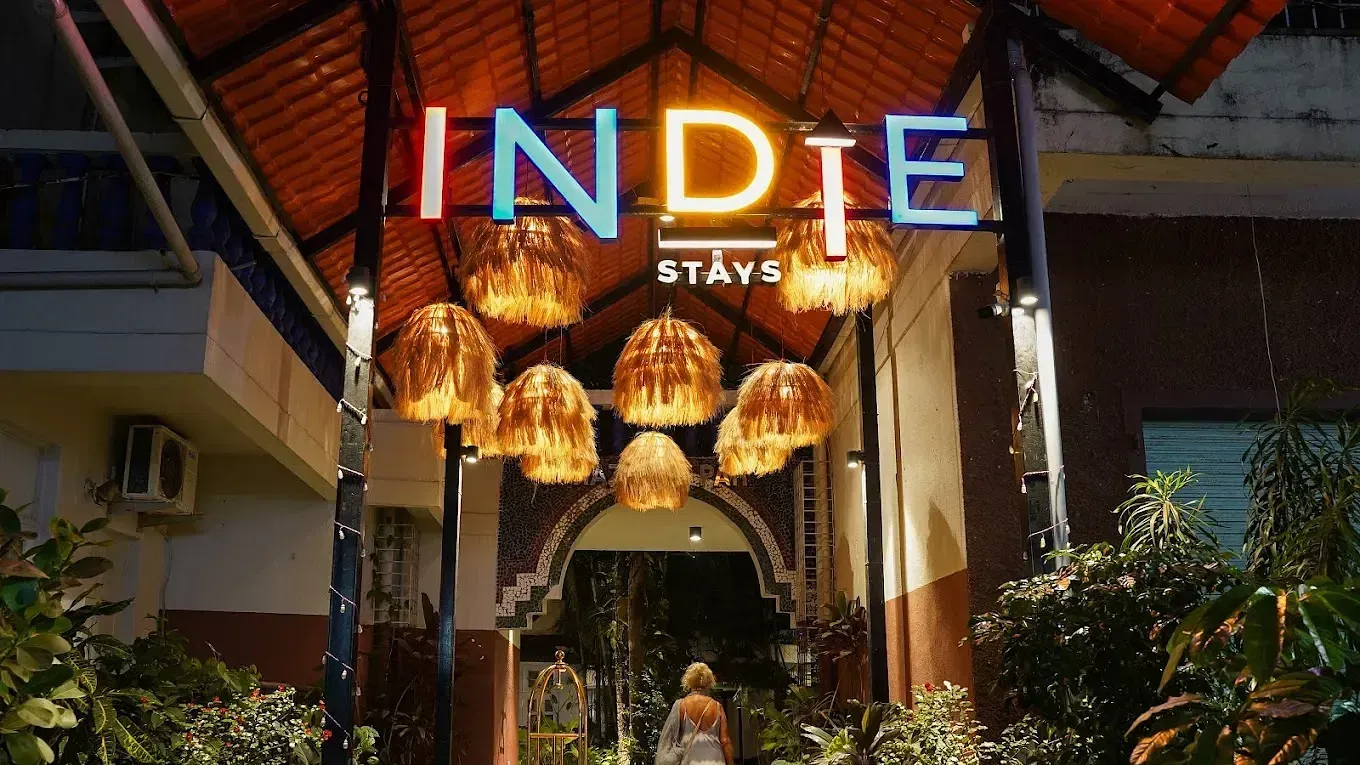 Entrance with a board sign to Indie Stays Resort, Goa
