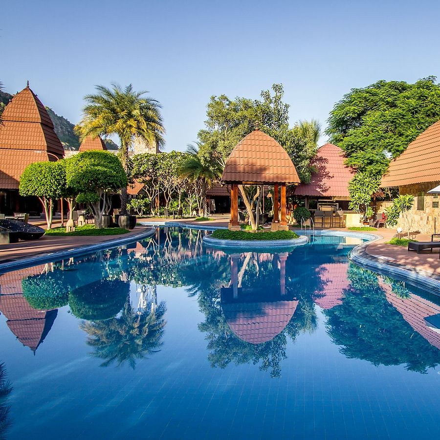 A panorama with the shades and lunge chairs around our day pool 