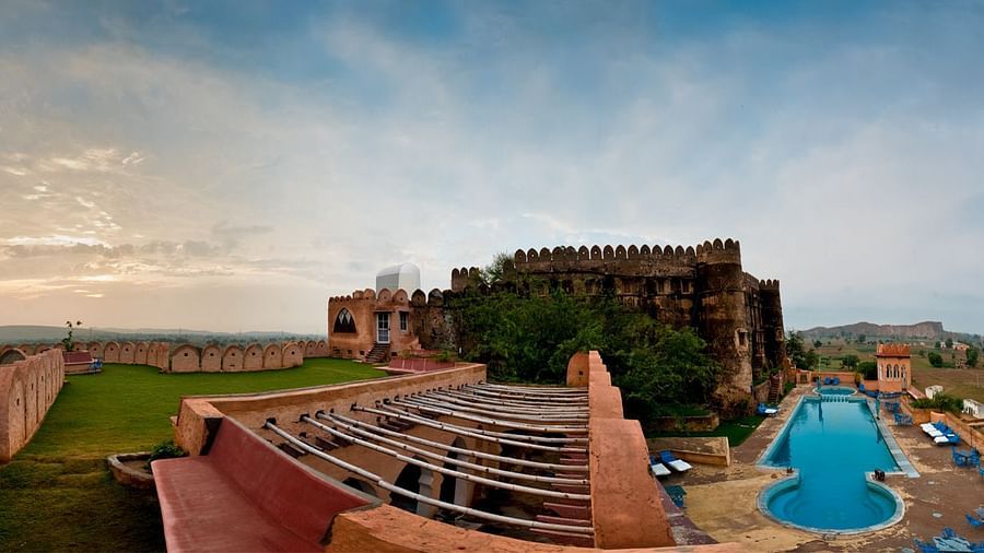 A long shot of the resort facade and premises - Resort in Rajasthan with Pool View