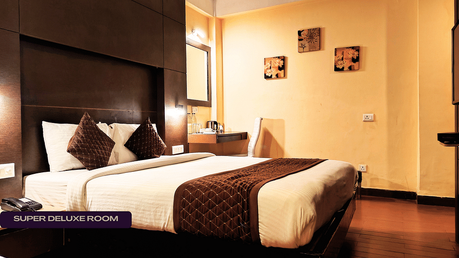 SUPER DELUXE ROOM with cosy bed and beautiful ambience