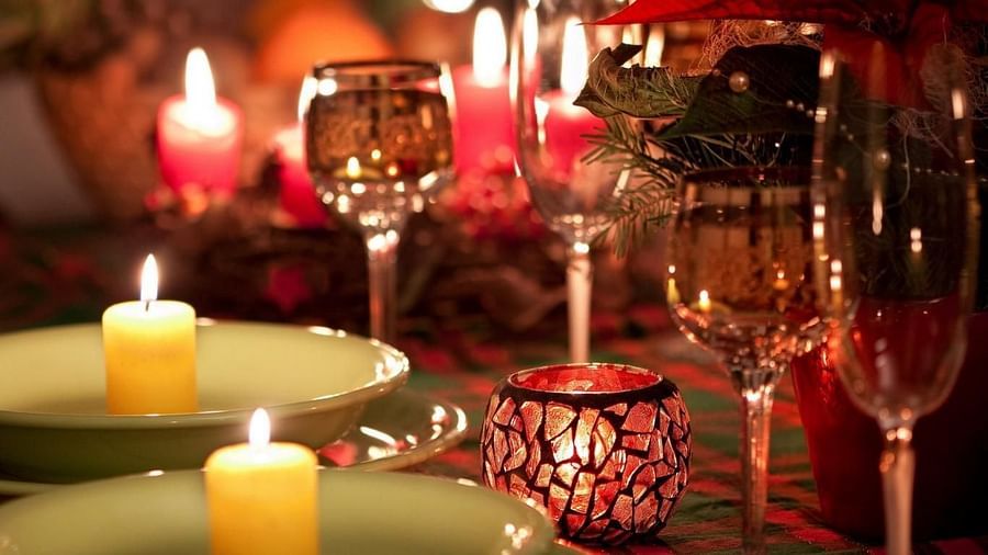 Image of a table with glasses and candles on it at Parampara Resort & Spa, Kushalnagar.