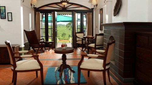 An overview of the Estate boutique bungalow's sitting area at Parisons Plantation, the perfect stay during your Wayanad Itinerary for 3-Days.