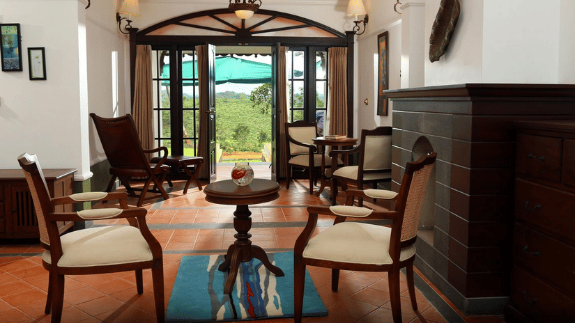 An overview of the Estate boutique bungalow's sitting area at Parisons Plantation, the perfect stay during your Wayanad Itinerary for 3-Days.