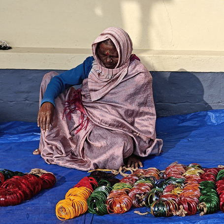 A woman selling bangles at Padi Igguthappa Temple