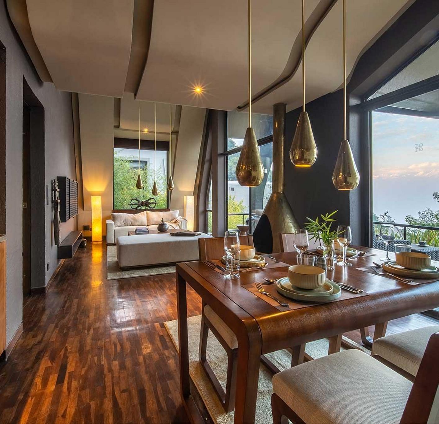 A four-seater dining table with bespoke lighting and a large window |  Kavya Resort and Spa, Nagarkot