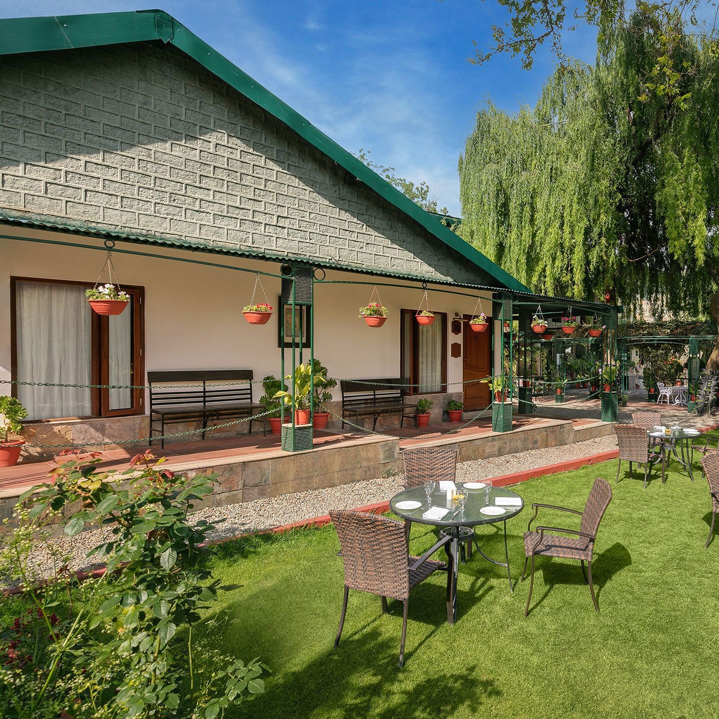 An outdoor area with lush green surrounding with mountains at Nainital Hilltop Nainital 