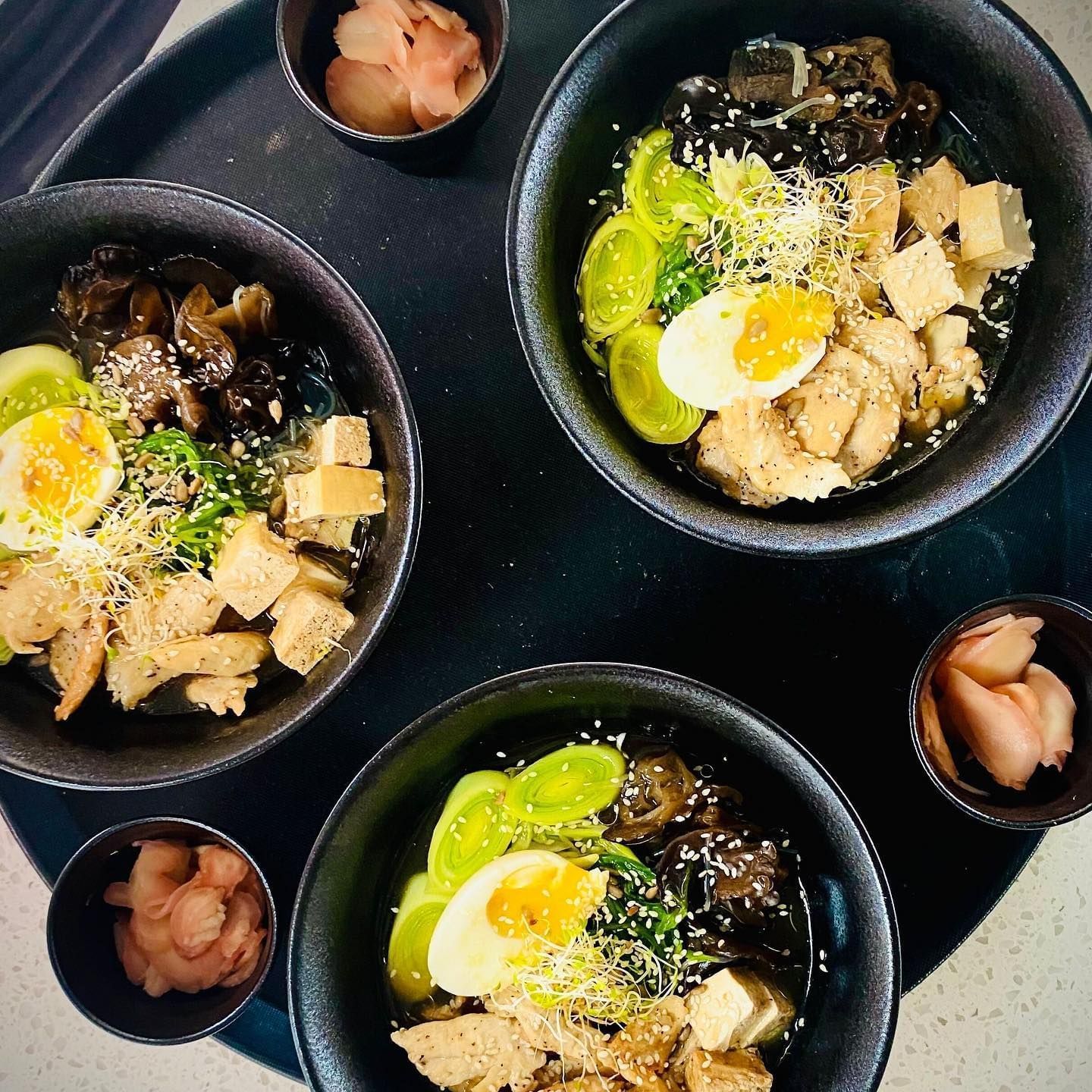 Bowls of assorted gourmet dishes featuring eggs, greens, and mushrooms at Tamarind Hills Resort and Villas, Antigua